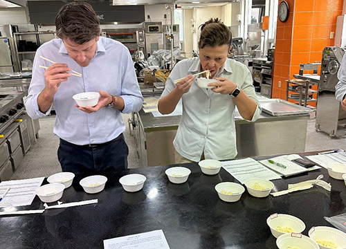 Dr Larisa Cato and Dr Dan Mullen taste noodles