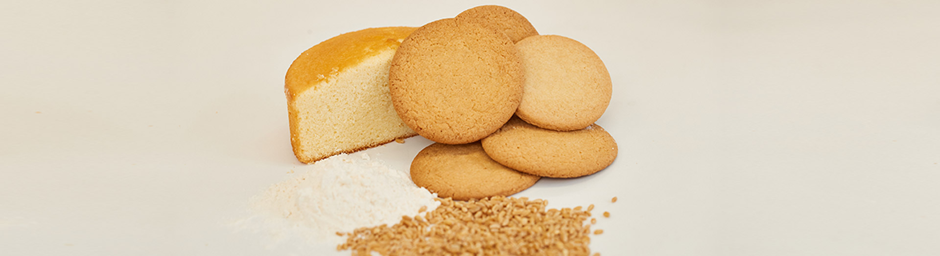 Cakes, cookies and a pile of wheat grains